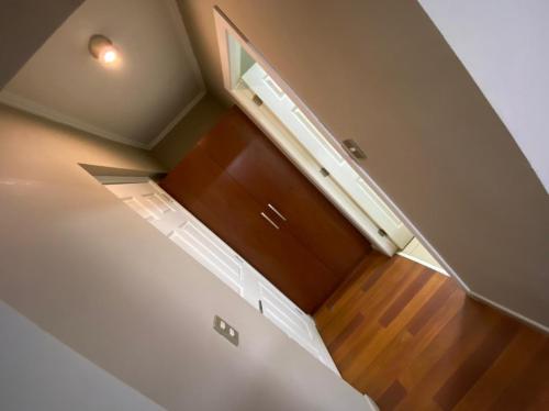 an overhead view of a staircase with a white refrigerator at Hotel San Martin in Cabrero