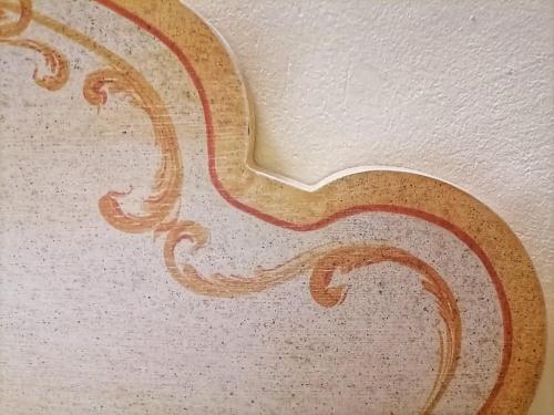a close up of a painting on a wall at Hotel Residence Sant'Anna in Bedonia