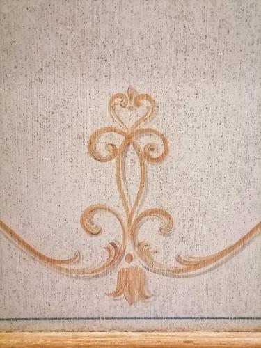 a painting of a flower on a wall at Hotel Residence Sant'Anna in Bedonia