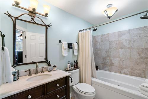 a bathroom with a sink and a toilet and a shower at Granite Hills Inn in Leavenworth