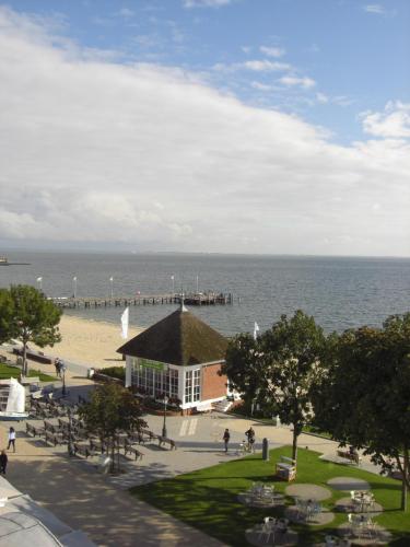 a view of a beach and a pier at Kurhaus Hotel in Wyk auf Föhr