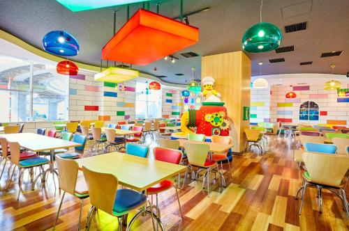 a restaurant with tables and chairs in a cafeteria at LEGOLAND New York Resort in Goshen