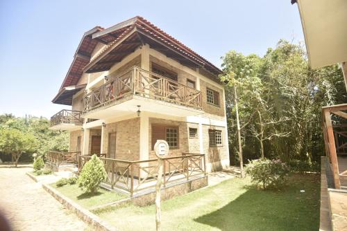 a house with a balcony on top of it at Sítio do Bosco Park in Tianguá