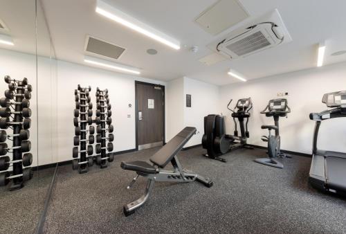 a gym with treadmills and exercise equipment in it at River Ness Hotel, a member of Radisson Individuals in Inverness