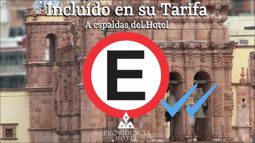 a red and white sign in front of a building at Hotel Providencia - Avenida Principal, Centro Histórico de Zacatecas in Zacatecas