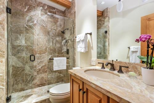 a bathroom with a sink and a toilet and a shower at Deluxe Two Bedroom - Aspen Alps #707 in Aspen