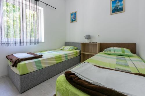 Posteľ alebo postele v izbe v ubytovaní Apartment DANIJEL