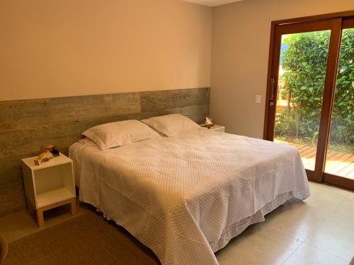 Ένα ή περισσότερα κρεβάτια σε δωμάτιο στο Pousada Maresia