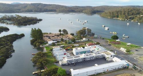 an aerial view of a lake with boats in the water at Batemans Bay Lodge in Batemans Bay