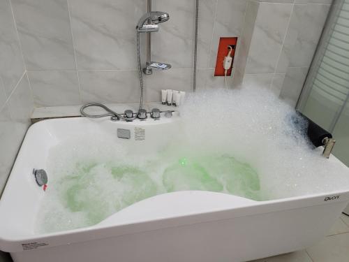 a bath tub filled with lots of water at ANDY'S PLACE in Legazpi