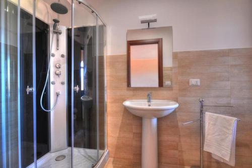 a bathroom with a sink and a shower at Holiday Home Floridia - ISI02100a-FYB in Floridia