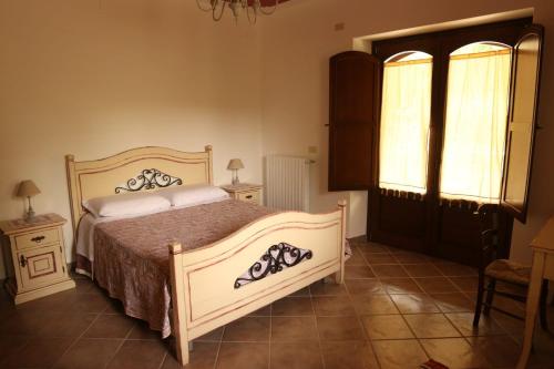 מיטה או מיטות בחדר ב-Villa Manca