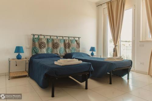 Кровать или кровати в номере Residence Le Stelle