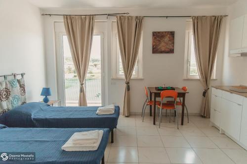 Ένα ή περισσότερα κρεβάτια σε δωμάτιο στο Residence Le Stelle
