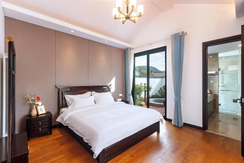 Ένα ή περισσότερα κρεβάτια σε δωμάτιο στο Mayu Valley Hot Spring Homestay