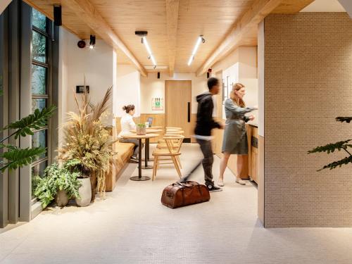 a group of people standing in an office lobby at Wren Urban Nest in Dublin