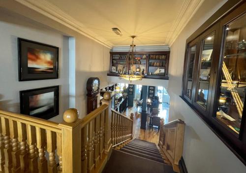 a staircase in a home with a stair case at Imperial Hotel in Tralee