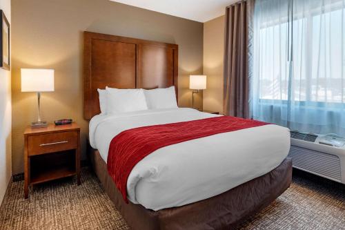 a hotel room with a large bed and a window at Comfort Inn La Porte in LaPorte