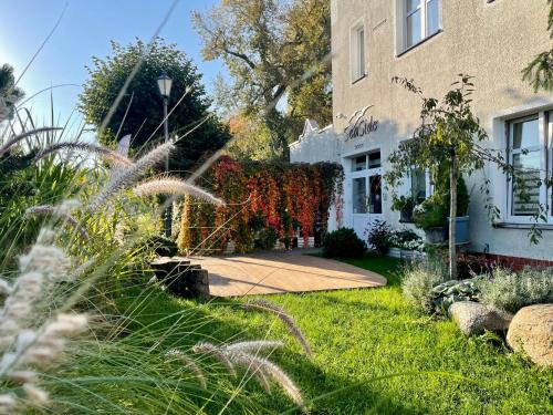 a garden in front of a building at SeaSide Sopot - tuż przy plaży in Sopot