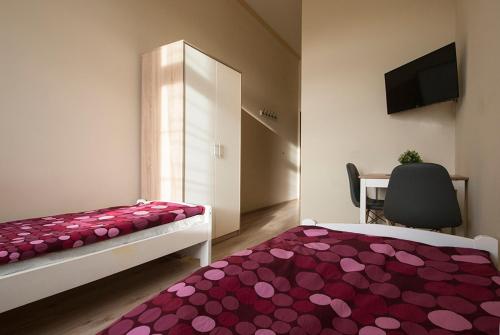 Łóżko lub łóżka w pokoju w obiekcie Vanilla Hostel Wrocław
