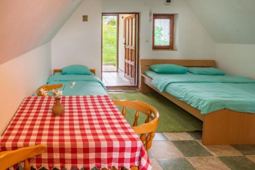 A bed or beds in a room at Family farm Jezera