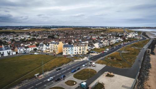 an aerial view of a city with houses and a street at The Norton- Hartlepool in Seaton Carew