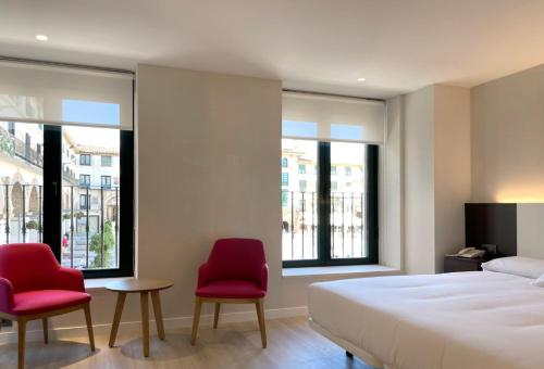 Postel nebo postele na pokoji v ubytování Hotel Remigio