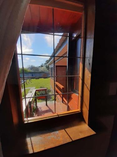 a view from a window of a balcony with a view at Cabañas Estrellas Doradas in Miramar
