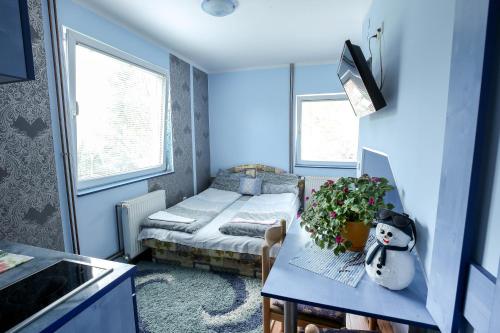 Ένα ή περισσότερα κρεβάτια σε δωμάτιο στο Vila Aris Zlatibor