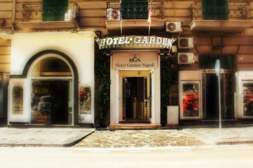 a store front of a building with a sign on it at Hotel Garden Napoli in Naples