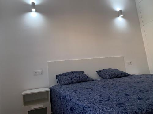 Postel nebo postele na pokoji v ubytování FANTASTIC APARTMENT. LOS CRISTIANOS. FREE WIFI.