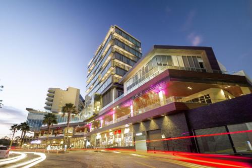 a building on a city street with buildings at The View Hotel by Covalia in San Luis Potosí