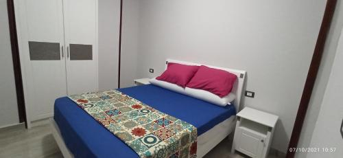 Llit o llits en una habitació de Houras 2022