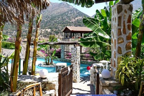 a resort with a swimming pool with a mountain in the background at Flat in Bali with Balcony in Balíon