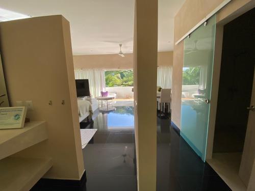 a living room with a view of a living room at CASA-22 Luxury Boutique Hotel in Sosúa