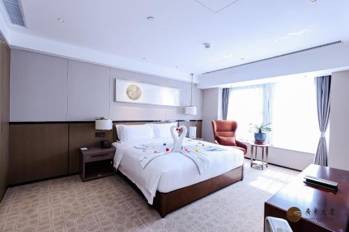Postel nebo postele na pokoji v ubytování Beijing Guangdong Hotel