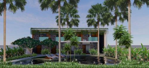 un edificio con palmeras delante en Bale Solah Lombok Holiday Resort, en Senggigi 