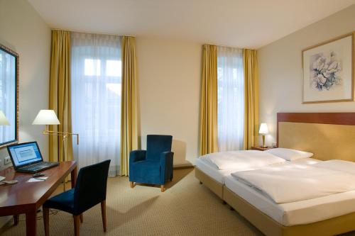 Säng eller sängar i ett rum på Novotel Hildesheim
