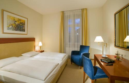 Postel nebo postele na pokoji v ubytování Novotel Hildesheim