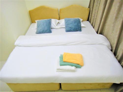 Abu Hail Star Residence - Home Stayにあるベッド