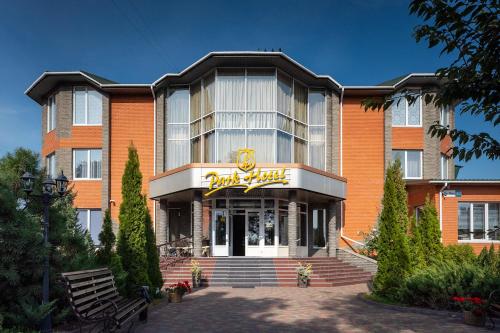 a hotel with a sign on the front of it at Park Hotel in Khmelʼnytsʼkyy