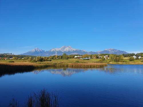 a large body of water with mountains in the background at Chatka Panorama in Mlynčeky
