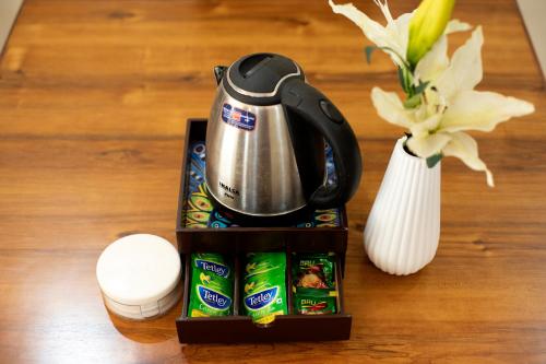 a coffee maker and some food on a table at Yogvan Luxury 1BHK Apartments Tapovan Rishikesh in Rishīkesh