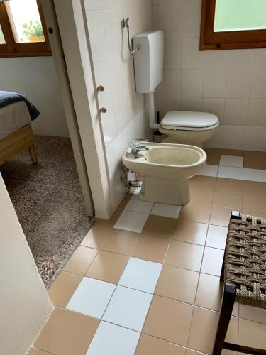 a bathroom with a toilet and a sink at camiBB in Castel del Rio