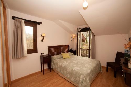 Llit o llits en una habitació de Hotel Rural Casa de Campo