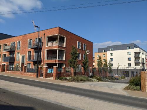 a red brick building on the side of a street at Suffield Lodge by Wycombe Apartments in High Wycombe