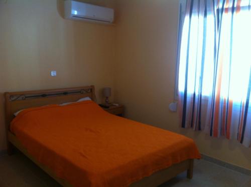 Ένα ή περισσότερα κρεβάτια σε δωμάτιο στο Melissa Rooms