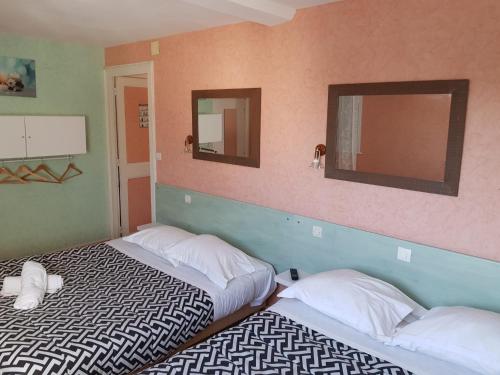 Ένα ή περισσότερα κρεβάτια σε δωμάτιο στο Hotellerie Normande