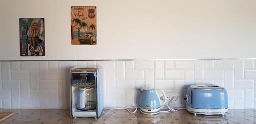 a kitchen with two toasters and a toaster at Gîte Lucian Mont-saint-michel in Moidrey