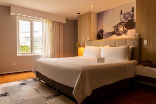 Katil atau katil-katil dalam bilik di Quo Quality Hotel